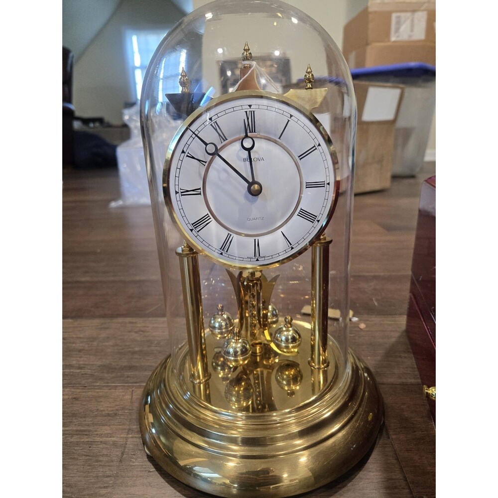 Bulova Tristan I B8818 Anniversary Clock - Glass Dome, Rotating Crystal Pendulum